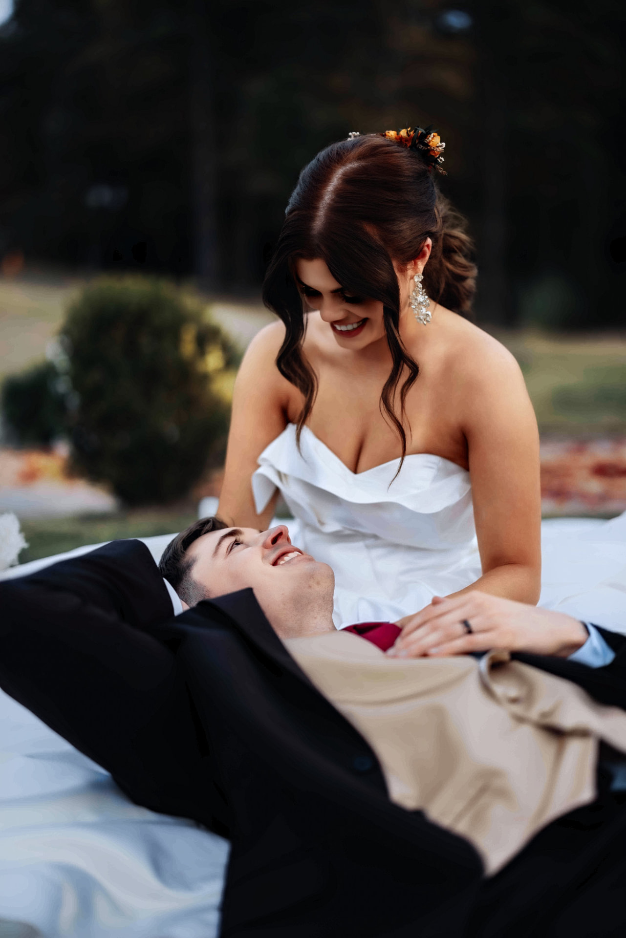 Newlyweds sharing a joyful moment outdoors